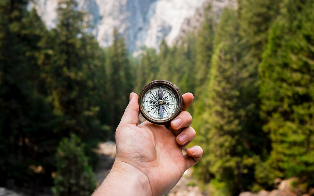 Using a compass to navigate the journey of uncovering past life memories.