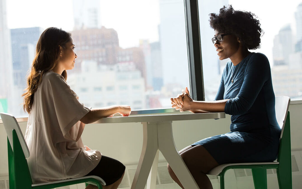 Two women talking during therapy session